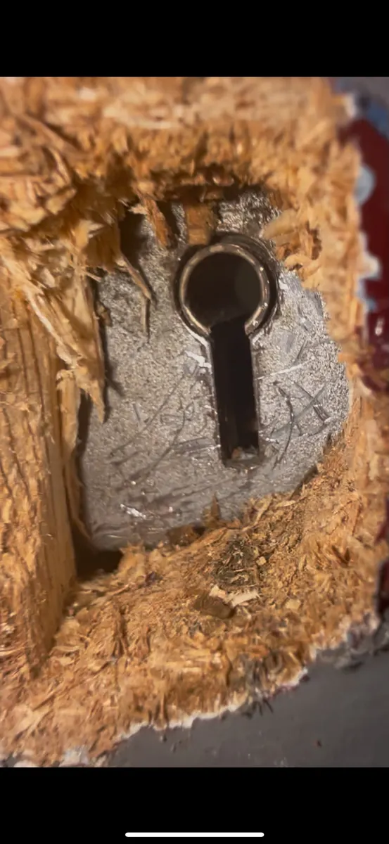 Split timber around a mortice lock after the door was forced.