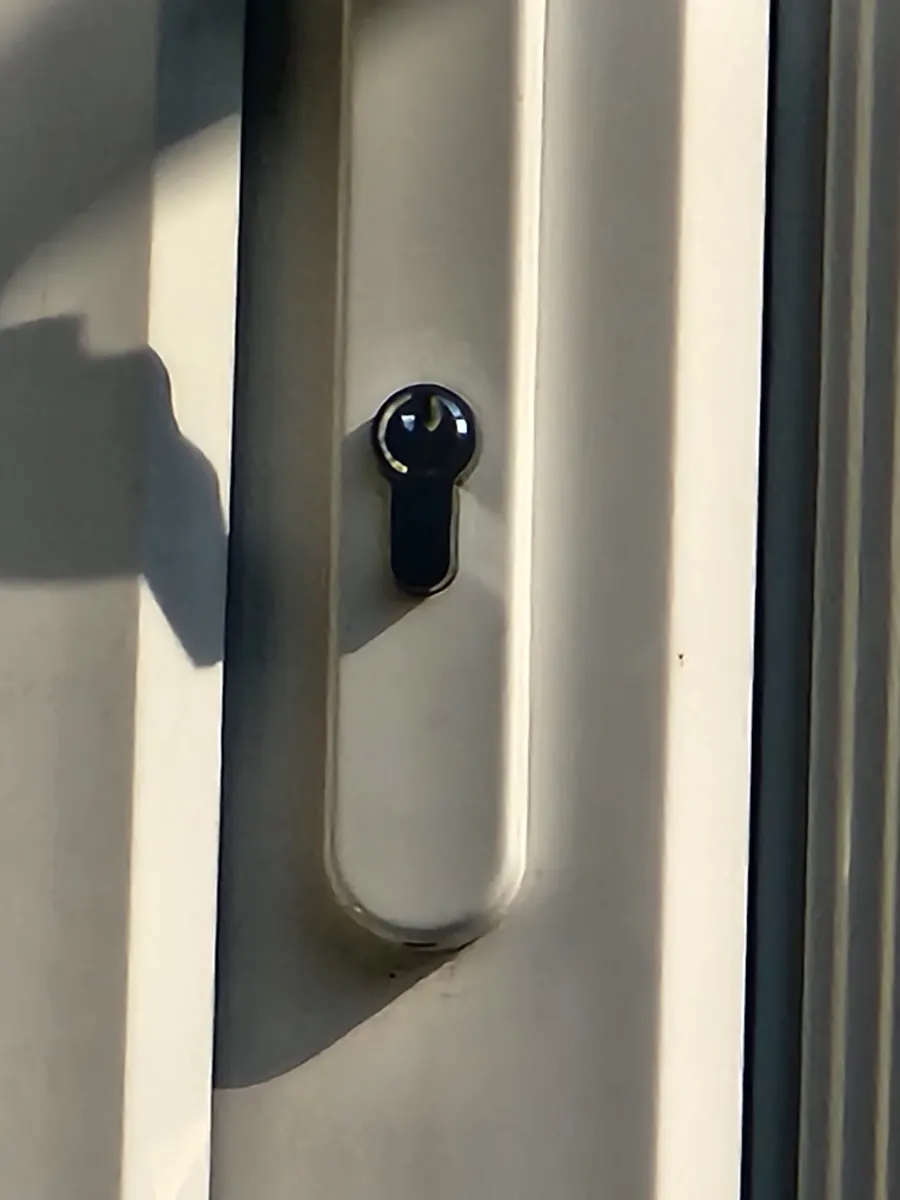 A uPVC door with a euro cylinder lock.